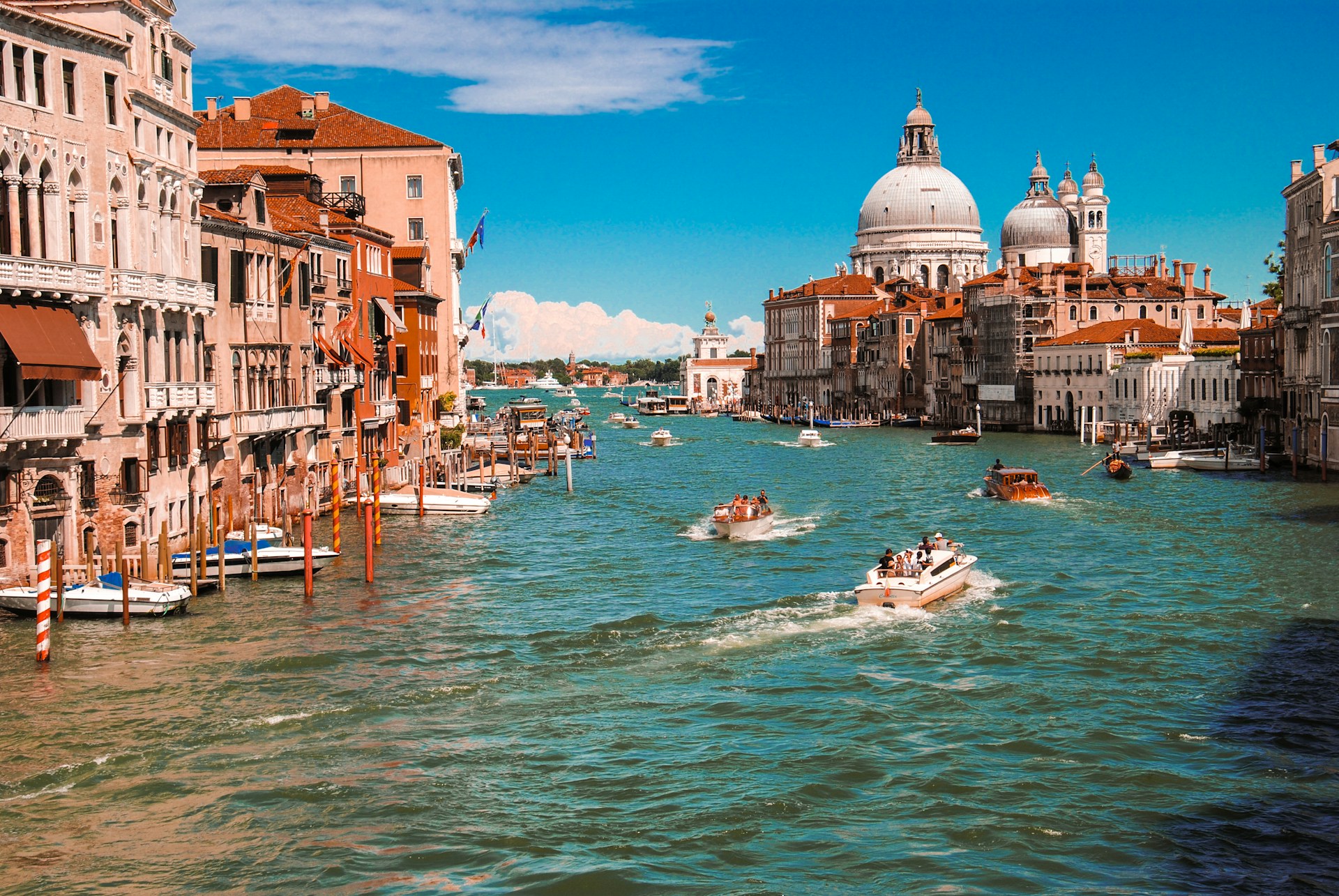 Vintage canal boats on the water of Venice, Italy.