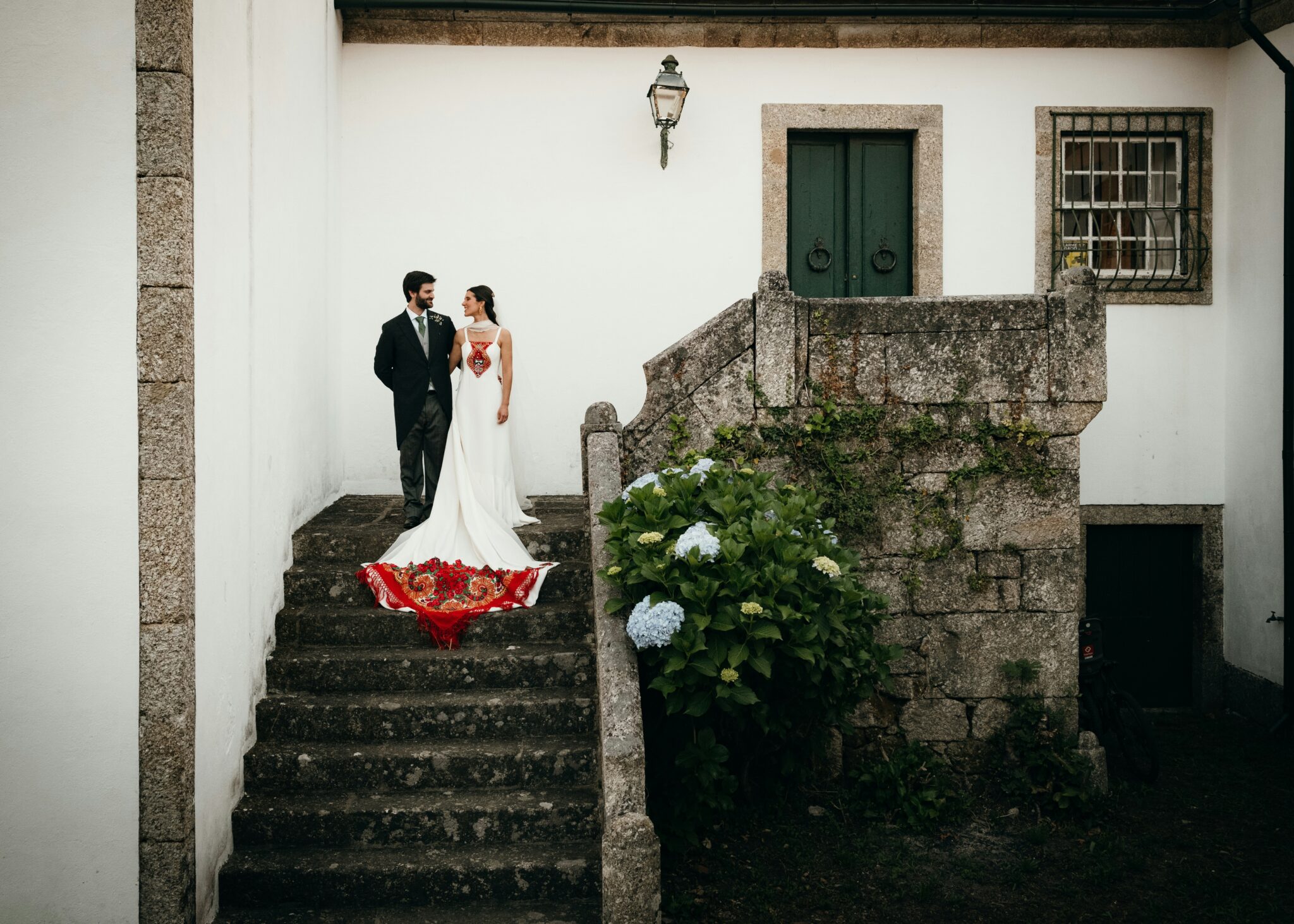 Couple on steps of a Portuguese quinta. 