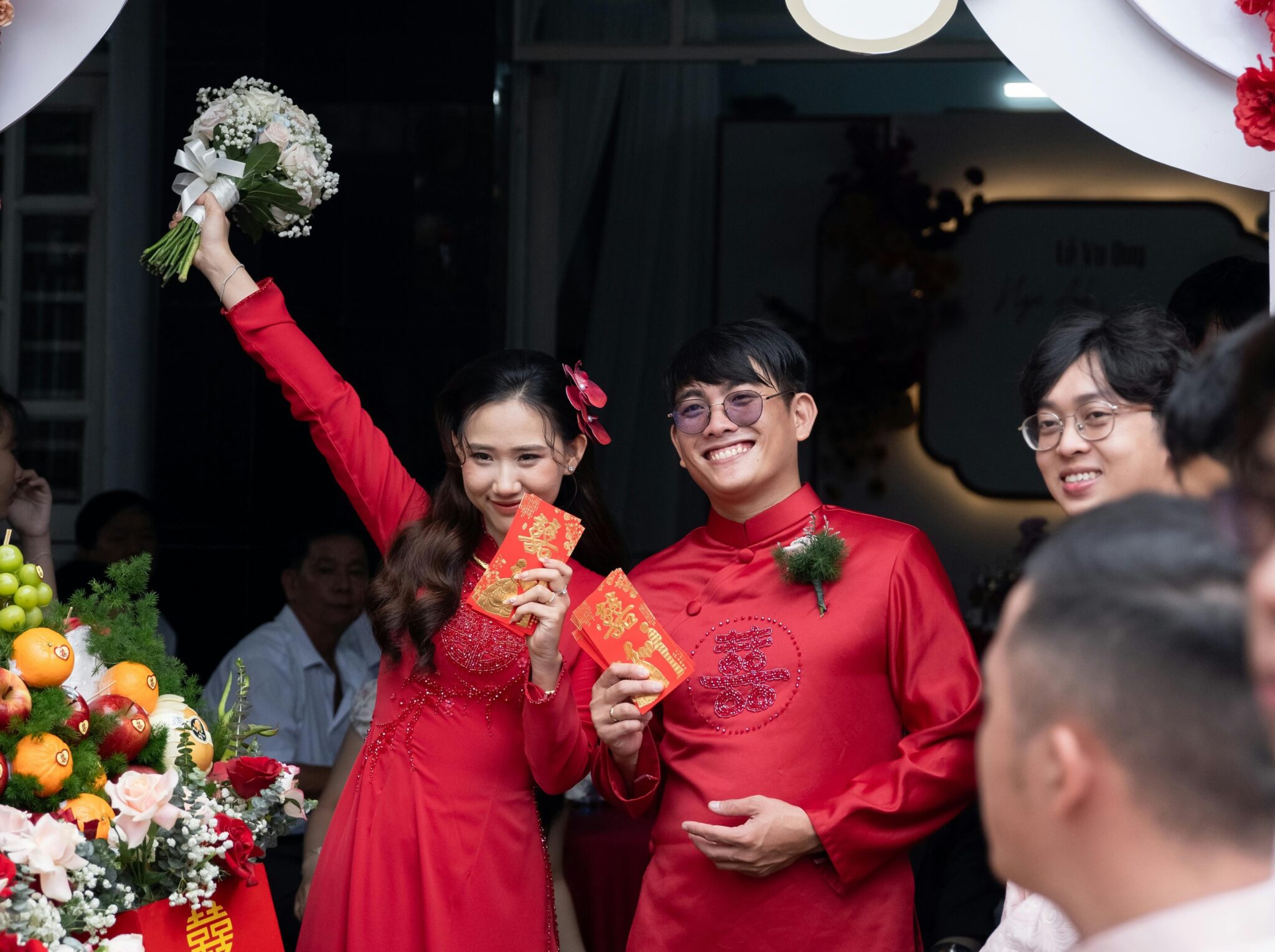 Couple holding red envelopes