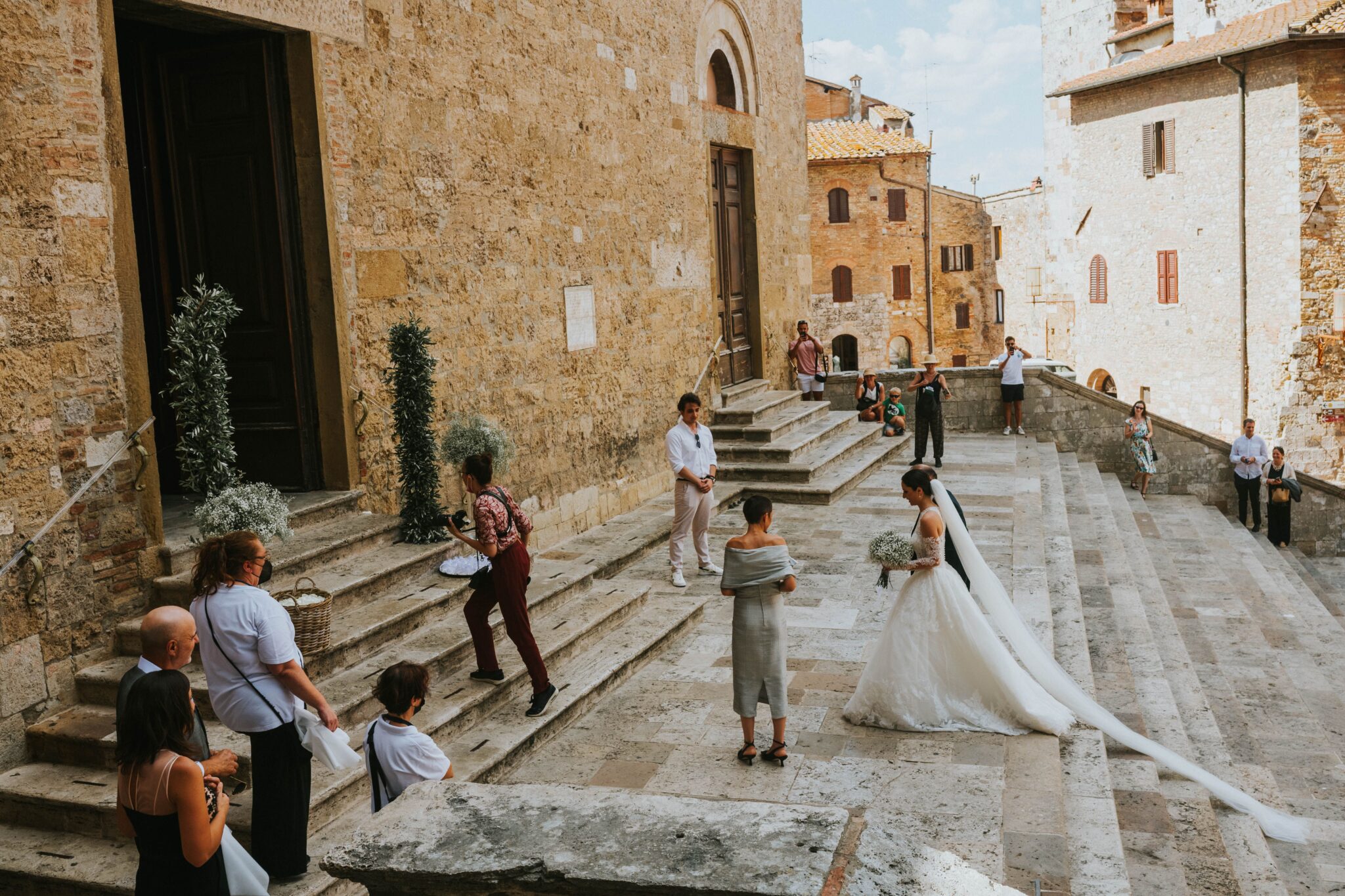 A bride being walked into a church in Italy