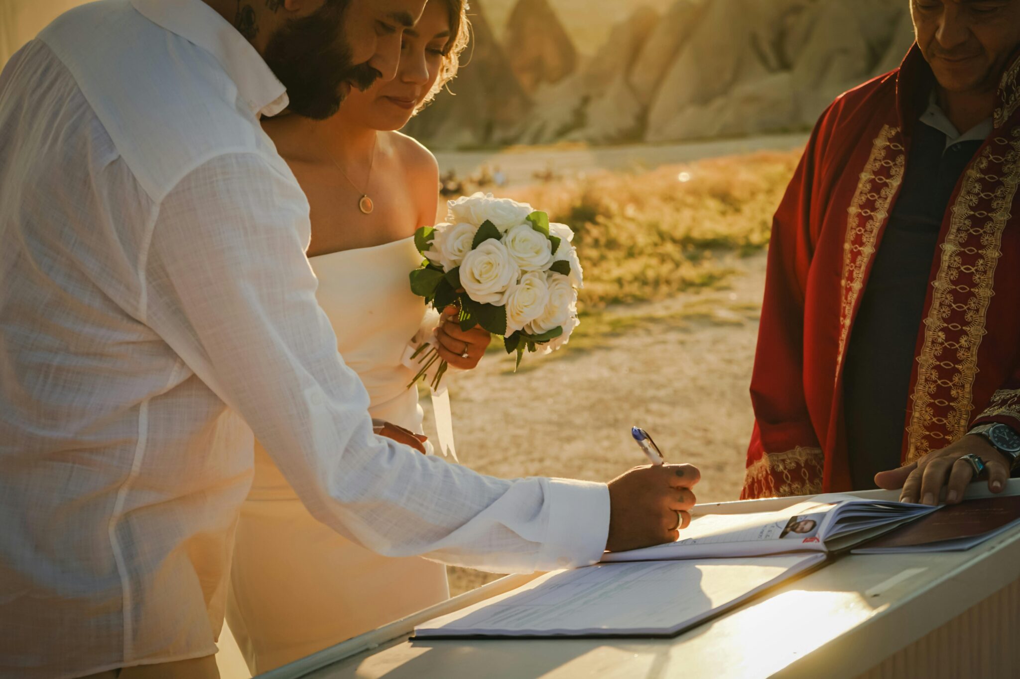 a couple signing their marriage certificate