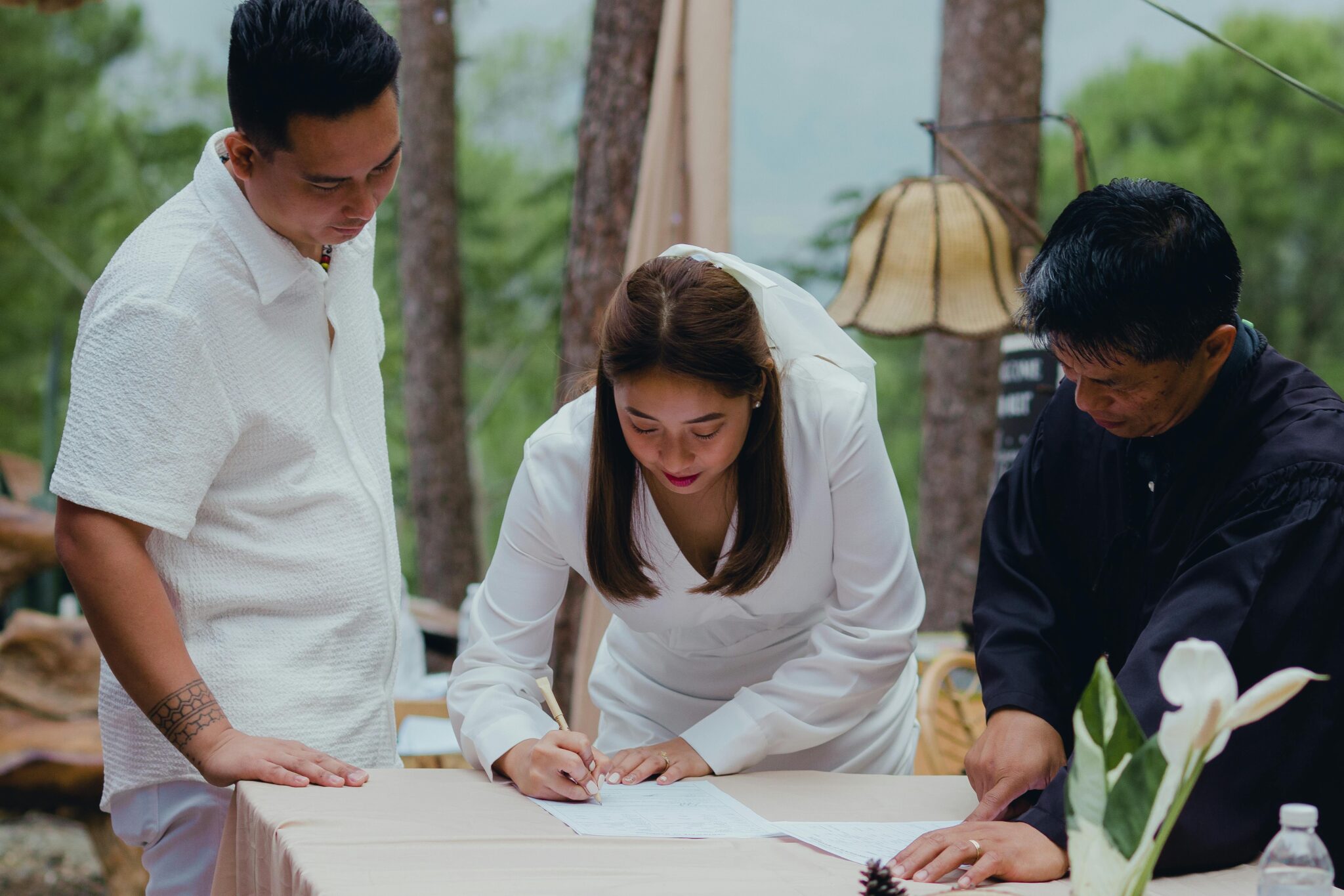 a bride signing papers