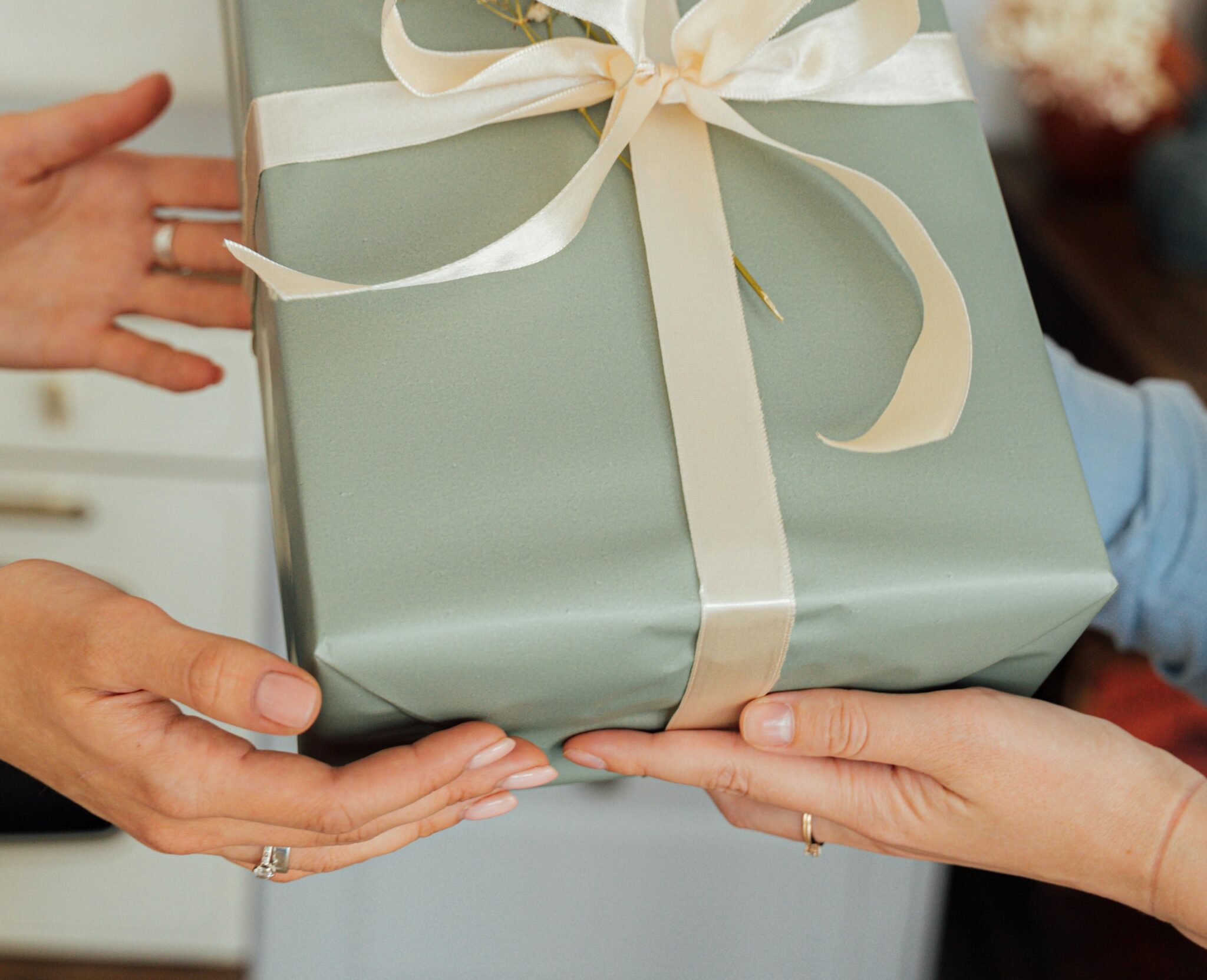 A photo of a gift being passed on