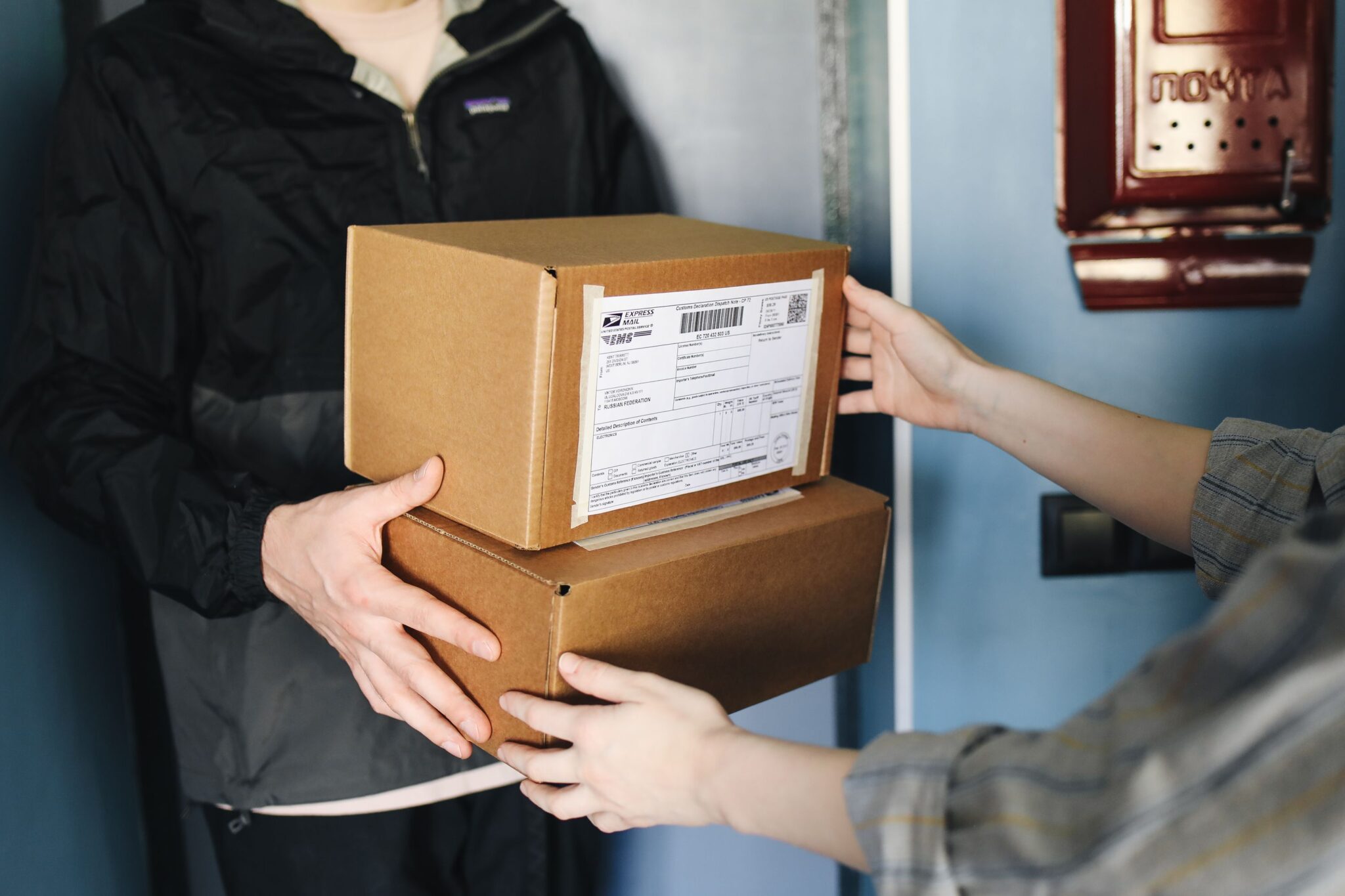 A photo of a person receiving a package