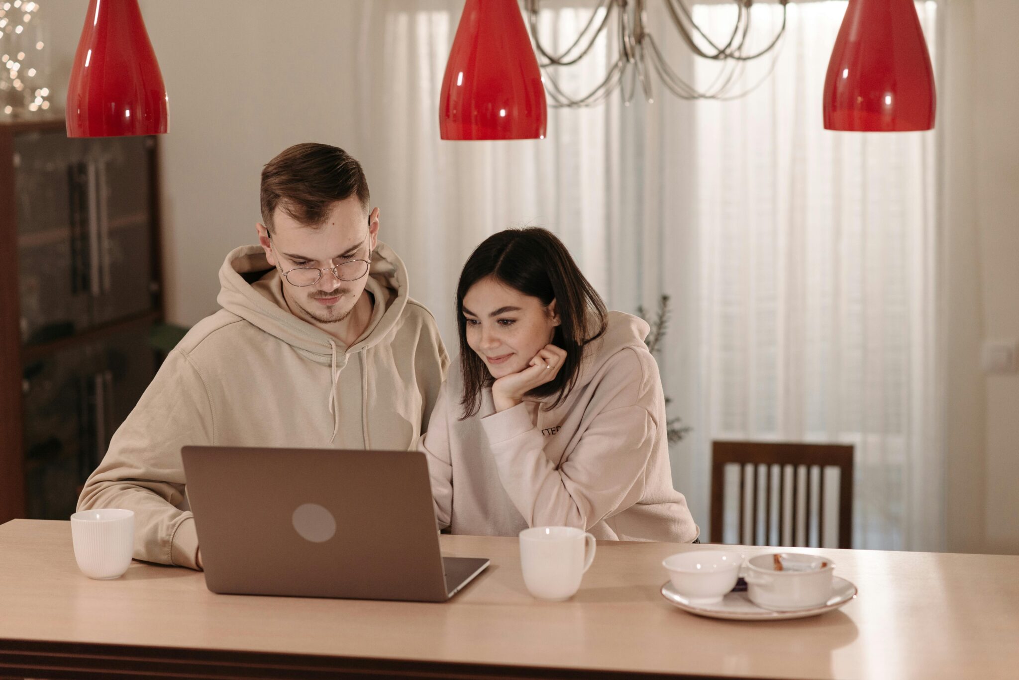 A couple planning, looking at a computer